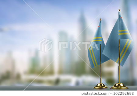 Small flags of the Aruba on an abstract blurry background 102292698