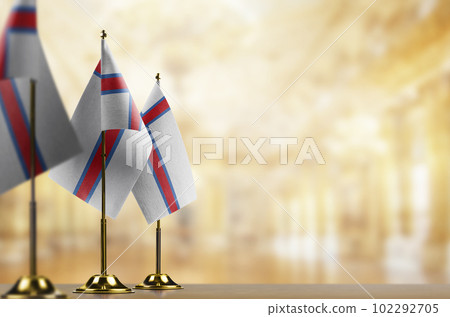 Small flags of the Faroe Islands on an abstract blurry background Small flags of the Faroe Islands on an abstract blurry background 102292705