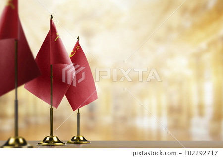 Small flags of the USSR on an abstract blurry background Small flags of the USSR on an abstract blurry background 102292717