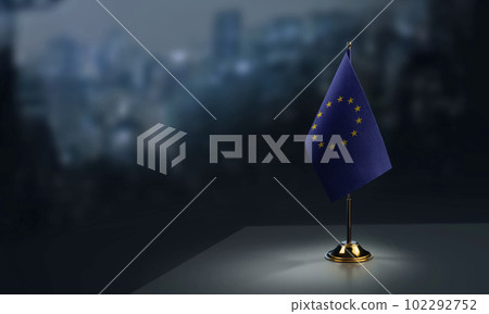 Small national flag of the European Union on a black background 102292752