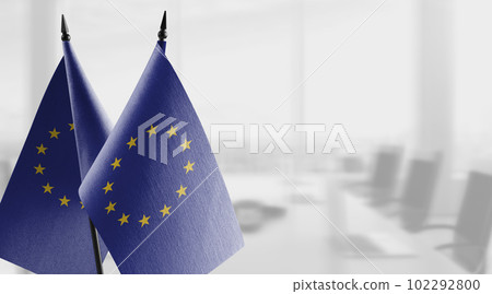 Small national flag of the European Union on a black background 102292800