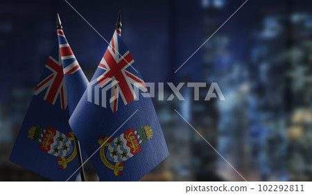 Small flags of the Cayman Islands on an abstract blurry background Small flags of the Cayman Islands on an abstract blurry background 102292811