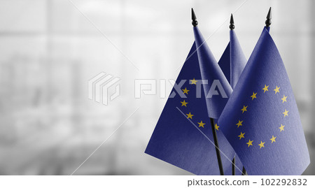 Small national flag of the European Union on a black background 102292832
