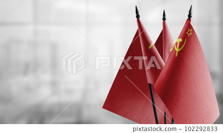 Small flags of the USSR on an abstract blurry background 102292833
