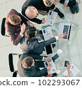 top view. working group discussing financial reports at an office meeting . 102293067