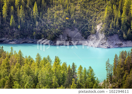Turquoise alpine lake in Swiss national park, Switzerland Turquoise alpine lake in Swiss national park, Switzerland 102294611