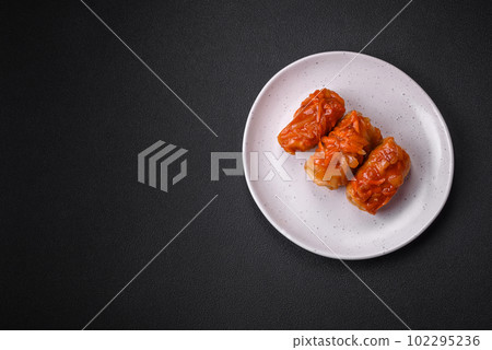 Delicious cabbage rolls with meat, rice, salt, spices and herbs Delicious cabbage rolls with meat, rice, salt, spices and herbs 102295236