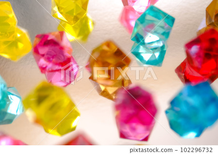 Multicolored crystal jewel background. Bright artificial gems. 102296732