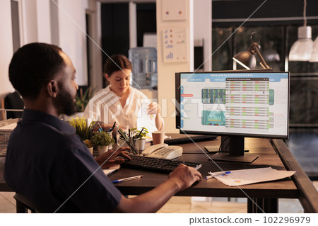 African american man analyzing fund market investment data on computer screen in coworking space, company financial statistics analysis. Businessman monitoring revenue in office African american man analyzing fund market investment data on computer screen in coworking space, company financial statistics analysis. Businessman monitoring revenue in office 102296979