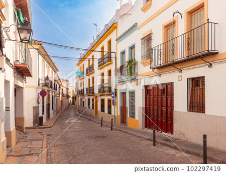 Cordova. Old traditional narrow city street with white houses. Cordova. Old traditional narrow city street with white houses. 102297419