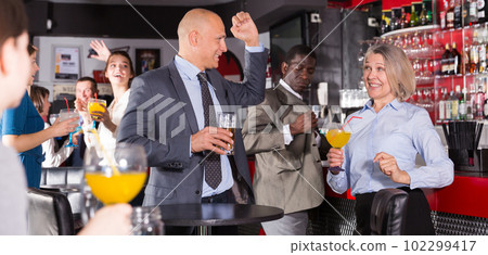Two colleagues having conversation Two colleagues having conversation 102299417