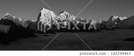 Snow capped mountains Cholatse, Taboche and Thamserku seen from Gokyo Ri, Nepal. 102299463