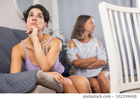 Annoyed stressed girlfriends ignoring each other after quarreling, LGBT relationship problems concept 102299488
