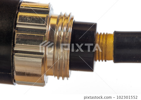 Close-up view of a pump blowing air into a valve of inner tube 102301552