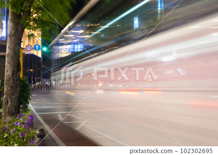Bus passing night view 102302695