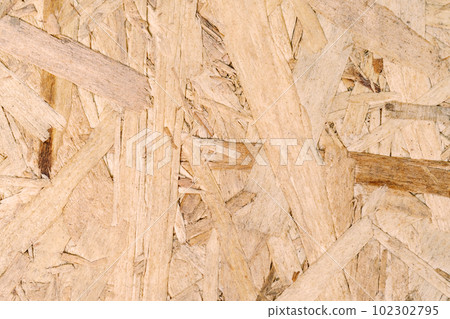 The texture of the OSB plate. Close-up. 102302795