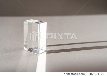 Transparent crystal prism on a white background. 102303178