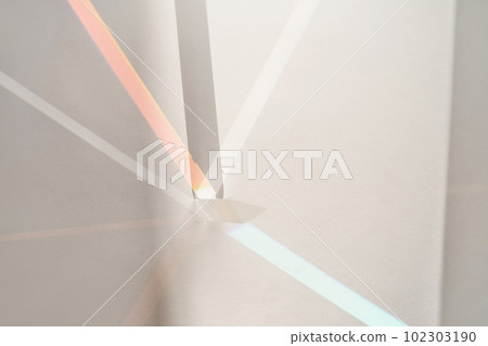 Transparent crystal prism on a white background. 102303190