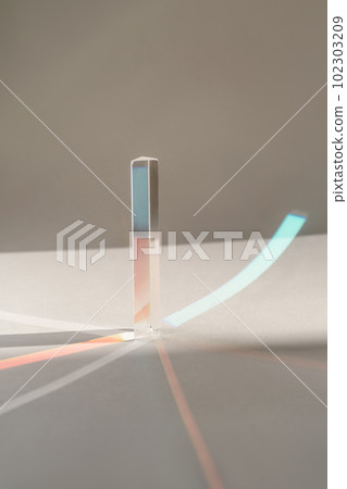 Transparent crystal prism on a white background. Transparent crystal prism on a white background. 102303209