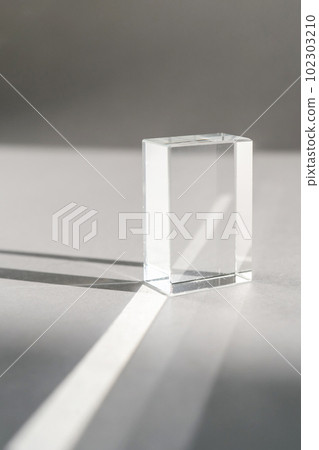 Transparent crystal prism on a white background. 102303210