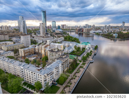 Yekaterinburg city and pond aerial panoramic view at summer sunset. Yekaterinburg city and pond aerial panoramic view at summer sunset. 102303620