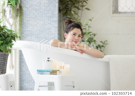 Female beauty Young woman taking a bath Female beauty Young woman taking a bath 102303714