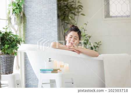 Female beauty Young woman taking a bath Female beauty Young woman taking a bath 102303718