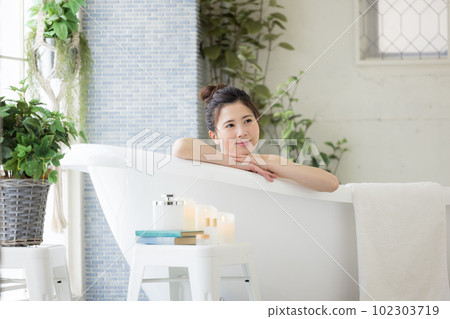 Female beauty Young woman taking a bath Female beauty Young woman taking a bath 102303719
