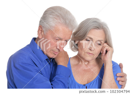 Portrait of sad senior couple isolated 102304794