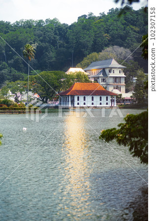 Kandy Lake and Famous City Landmark Sri Dalada Maligawa, Sacred Tooth Relic The Temple in Sri Lanka. Kandy Lake and Famous City Landmark Sri Dalada Maligawa, Sacred Tooth Relic The Temple in Sri Lanka. 102307158