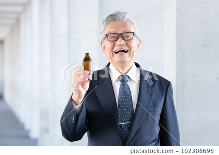 Businessman senior nutrition drink 102308698
