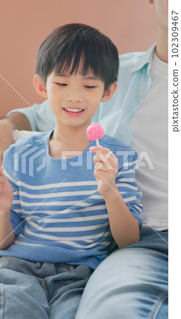 asian boy eat unhealthy food asian boy eat unhealthy food 102309467