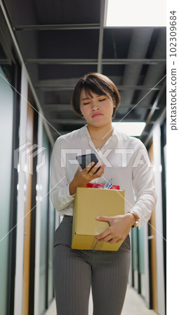 Asian woman is dismissed Asian woman is dismissed 102309684