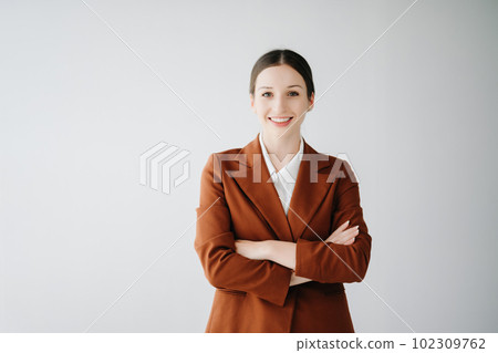 Smiling caucasian young businesswoman bank employee worker manager boss ceo looking at camera, using tablet, laptop and notepad online isolated in white background. Smiling caucasian young businesswoman bank employee worker manager boss ceo looking at camera, using tablet, laptop and notepad online isolated in white background. 102309762