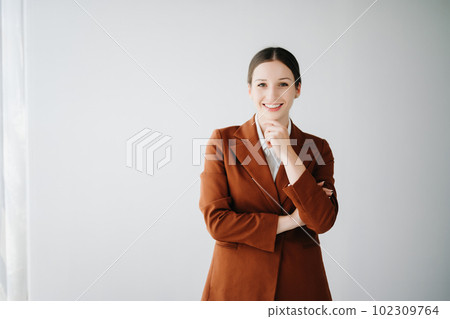 Smiling caucasian young businesswoman bank employee worker manager boss ceo looking at camera, using tablet, laptop and notepad online isolated in white background. Smiling caucasian young businesswoman bank employee worker manager boss ceo looking at camera, using tablet, laptop and notepad online isolated in white background. 102309764