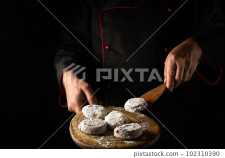 Cooking minced meat with beef and pork meat for burger cutlet by cook chef hands. Free space for restaurant or hotel menu on black background Cooking minced meat with beef and pork meat for burger cutlet by cook chef hands. Free space for restaurant or hotel menu on black background 102310390