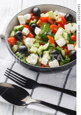 Coban Salatsi Turkish Shepherds Salad closeup on the bowl. Vertical 102310491