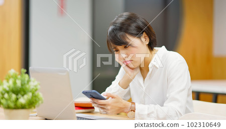 businesswoman looking on mobile 102310649