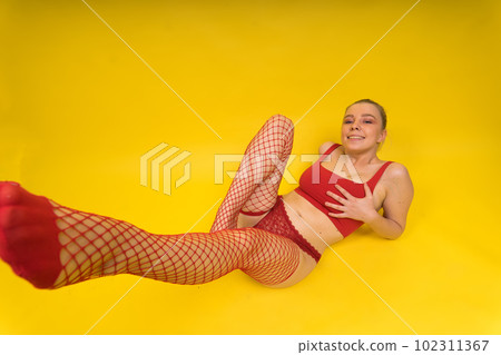 Fashion portrait of young beautiful woman with big breasts. Carefree model wearing lingerie. 102311367