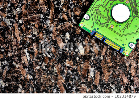 Internal hard drive for storing information on a marble brown black surface  102314879