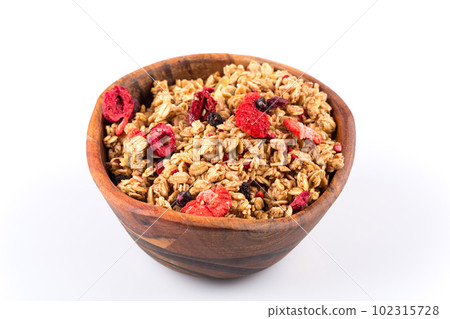 Muesli oat cereals close up background with dry fruits 102315728