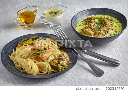 Fried poultry chicken baked with garlic and herbs in milk cream and noodles Fried poultry chicken baked with garlic and herbs in milk cream and noodles 102316391