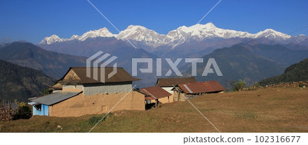 Farmhouses near Ghale Gaun and Manaslu Range, Nepal. 102316677