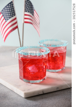 Patriotic red pomegranate margarita for July 4th. 102317528