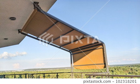 Awning on the terrace. Penthouse on the top floor with a terrace and a gorgeous view of the forest. Awning on the terrace. Penthouse on the top floor with a terrace and a gorgeous view of the forest. 102318201