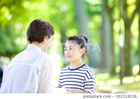 Adults and children lined up with smiles 102318336