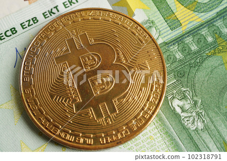 Golden bitcoin on Euro banknotes money for business and commercial, Digital currency, Virtual cryptocurrency. Golden bitcoin on Euro banknotes money for business and commercial, Digital currency, Virtual cryptocurrency. 102318791