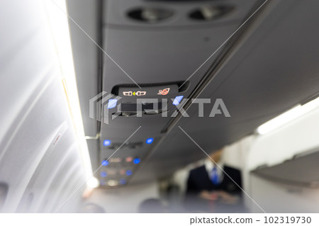 Burning No Smoking Sign and Fasten Seat Belt on Board Aircraft Burning No Smoking Sign and Fasten Seat Belt on Board Aircraft 102319730