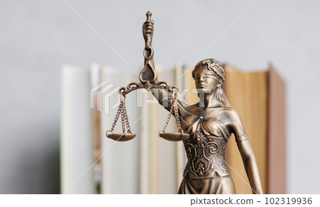 themis goddess of justice statuette, symbol of law with scales and sword in his hands 102319936