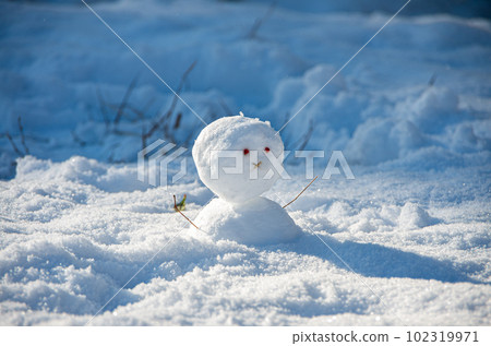 little snowman standing on the snow little snowman standing on the snow 102319971
